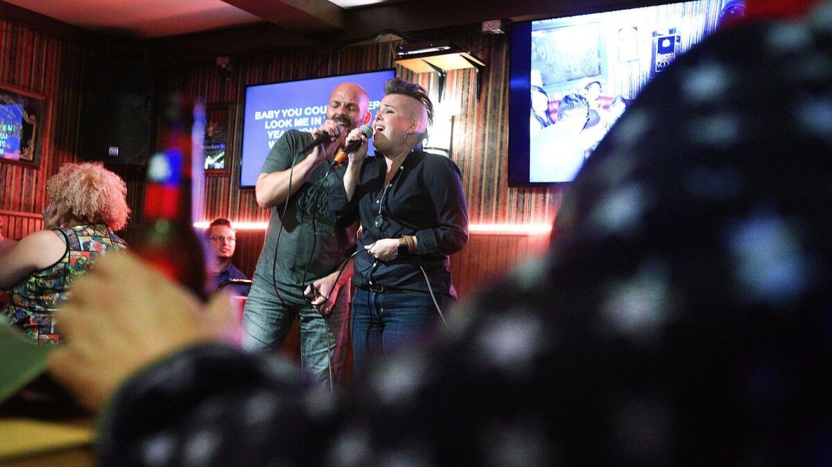 Burbank residents David and Janelle Polk sing "Stop Draggin' My Heart Around," a duet originally sung by Stevie Nicks and Tom Petty. The couple met at Sardo's Grill & Lounge nine years ago and have been married since.