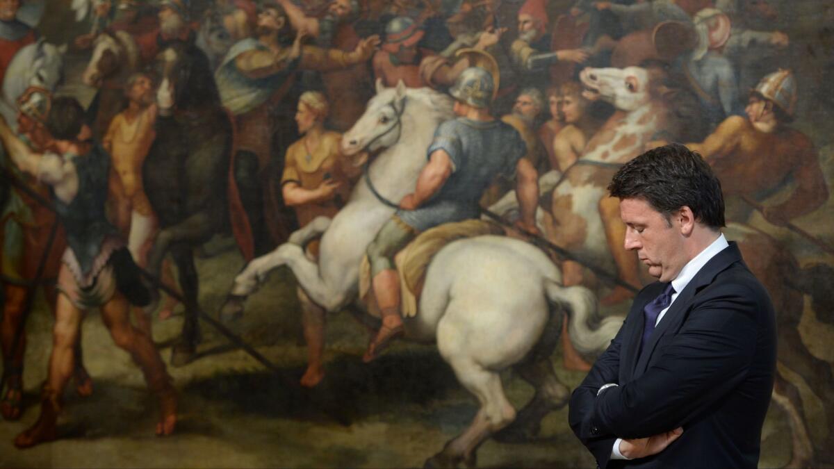 Italian Prime Minister Matteo Renzi stands in front of a fresco in the Palazzo Chigi in Rome in this June 23 file photo.