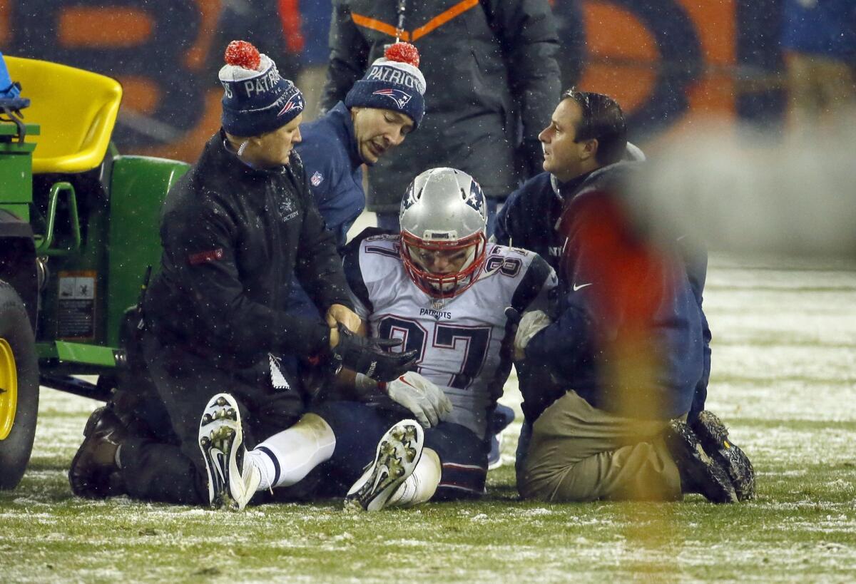 New England tight end Rob Gronkowski is attended to after being injured against Denver on Sunday night.