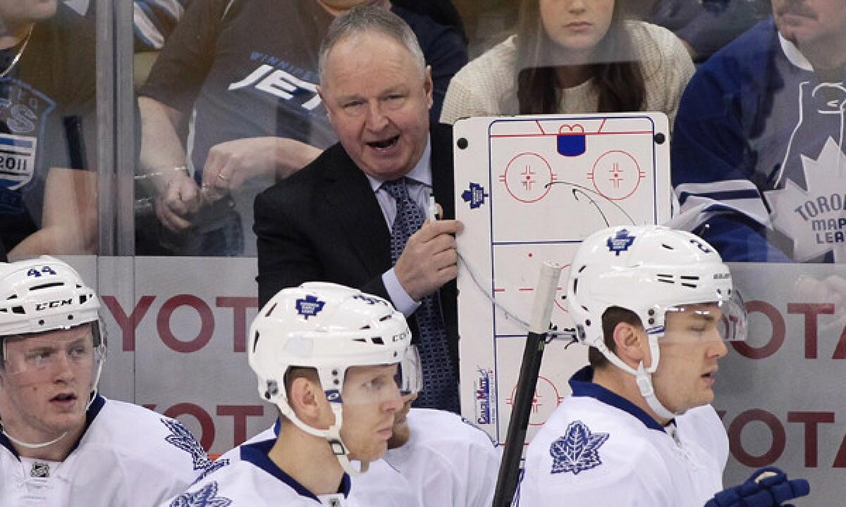 Toronto Maple Leafs Coach Randy Carlyle speaks to his players during a game against the Winnipeg Jets on Jan. 25. Carlyle, who guided the Ducks to a Stanley Cup title in 2007, holds nothing against his former employer.