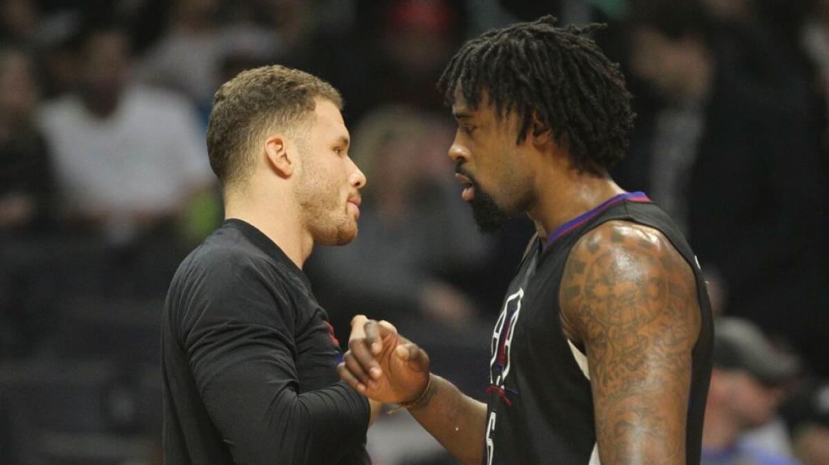 Clippers center DeAndre Jordan, right, and forward Blake Griffin talk during a game against the Pelicans on Dec. 10 at Staples Center.