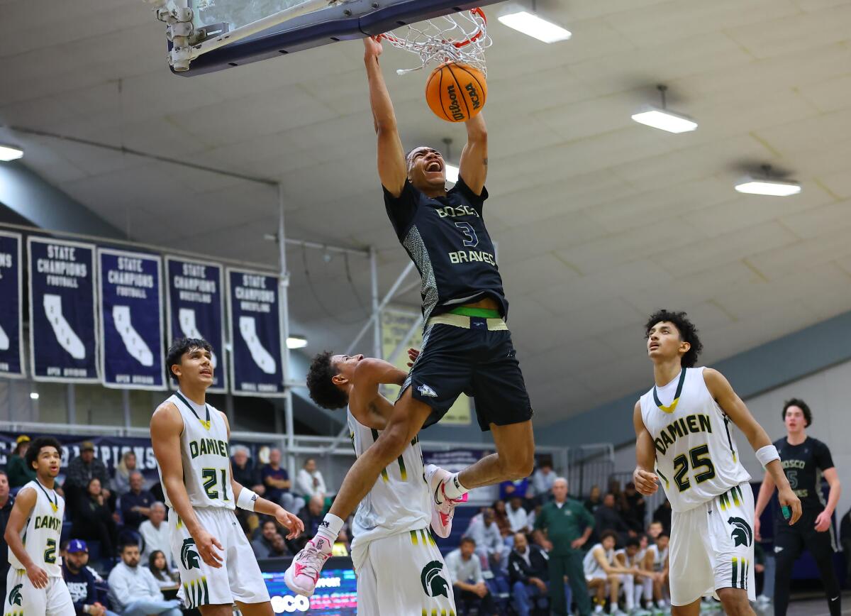 Elzie Harrington of St. John Bosco High puts down a two-handed dunk