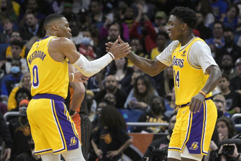 Los Angeles Lakers guard Russell Westbrook (0) congratulates forward Stanley Johnson.