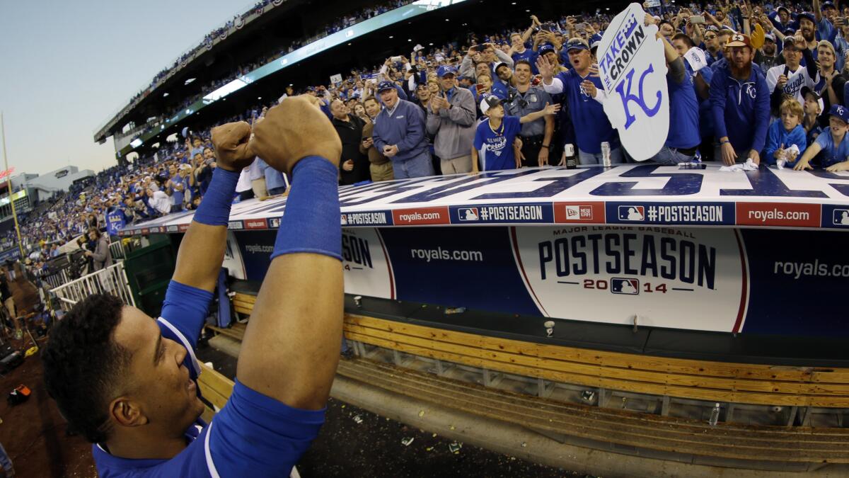 Kansas City's Salvador Perez celebrates with fans after the Royals' American League Championship Series win over the Baltimore Orioles on Wednesday.