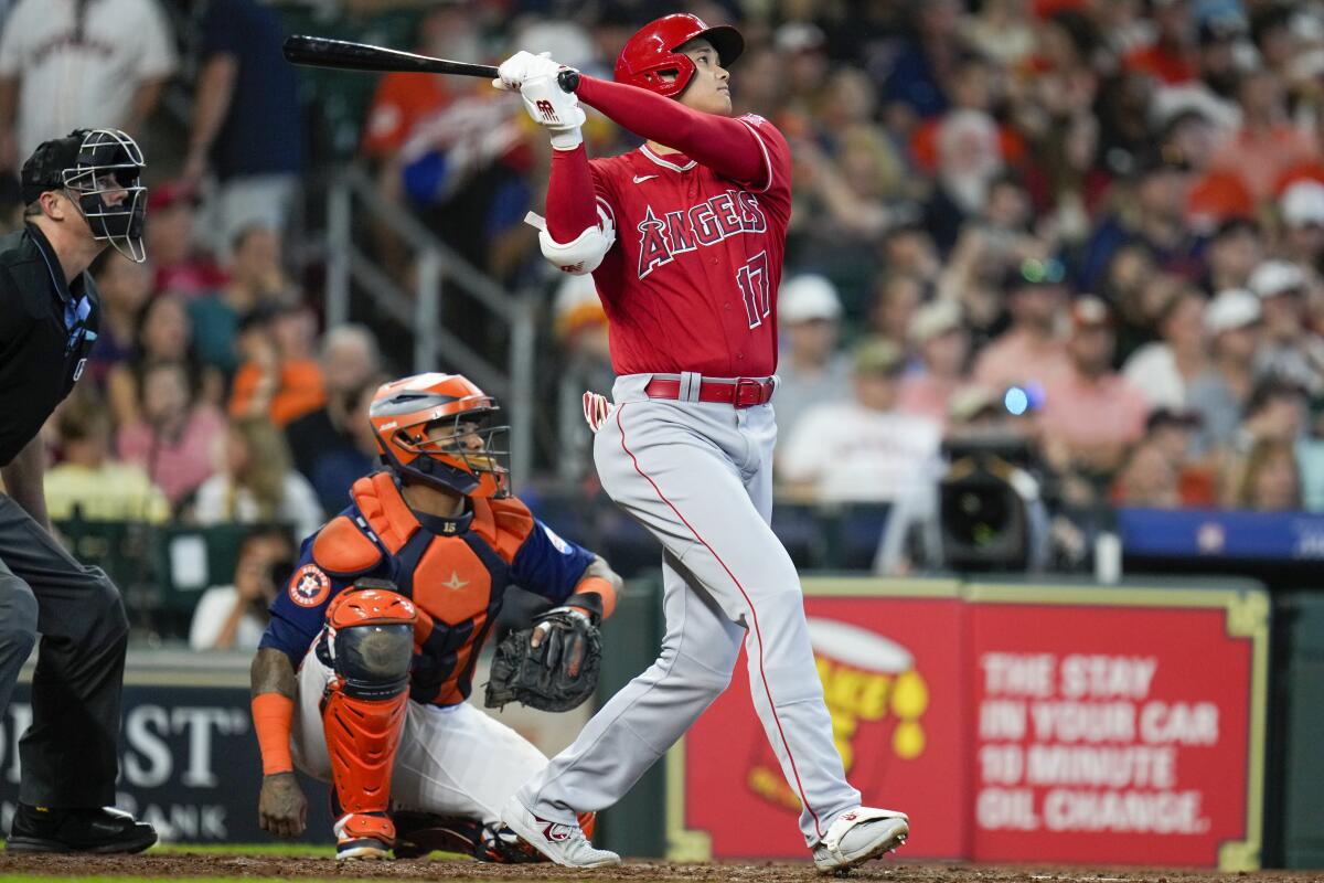 Los Angeles Angels designated hitter Shohei Ohtani hits a home run against the Houston Astros on Aug. 13, 2023, in Houston.
