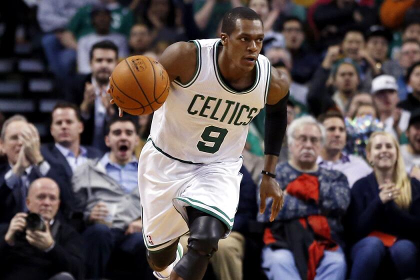 Celtics point guard Rajon Rondo dribbles up the court during a Dec. 3 game against the Detroit Pistons in Boston.