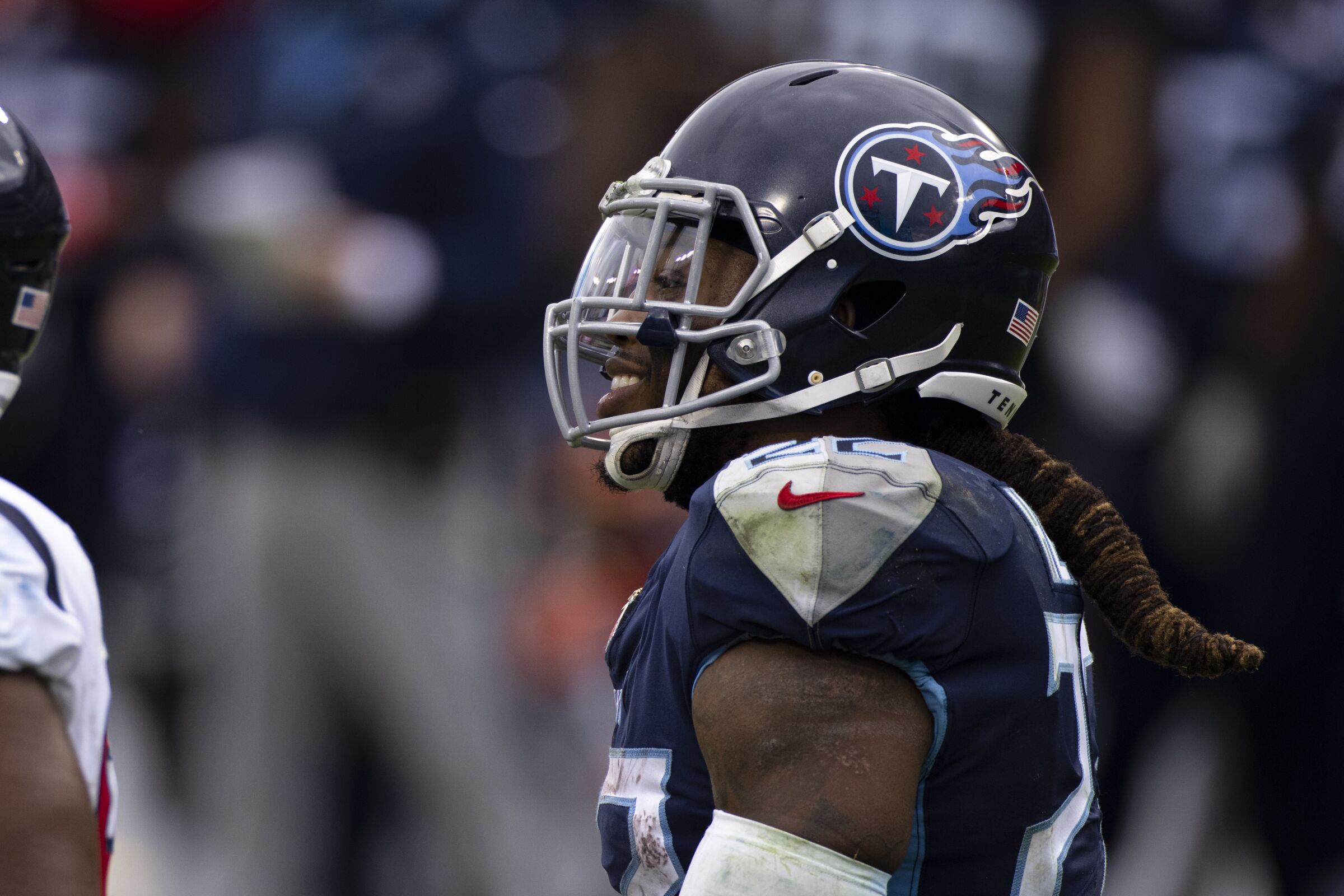 Tennessee Titans running back Derrick Henry smiles after a run.