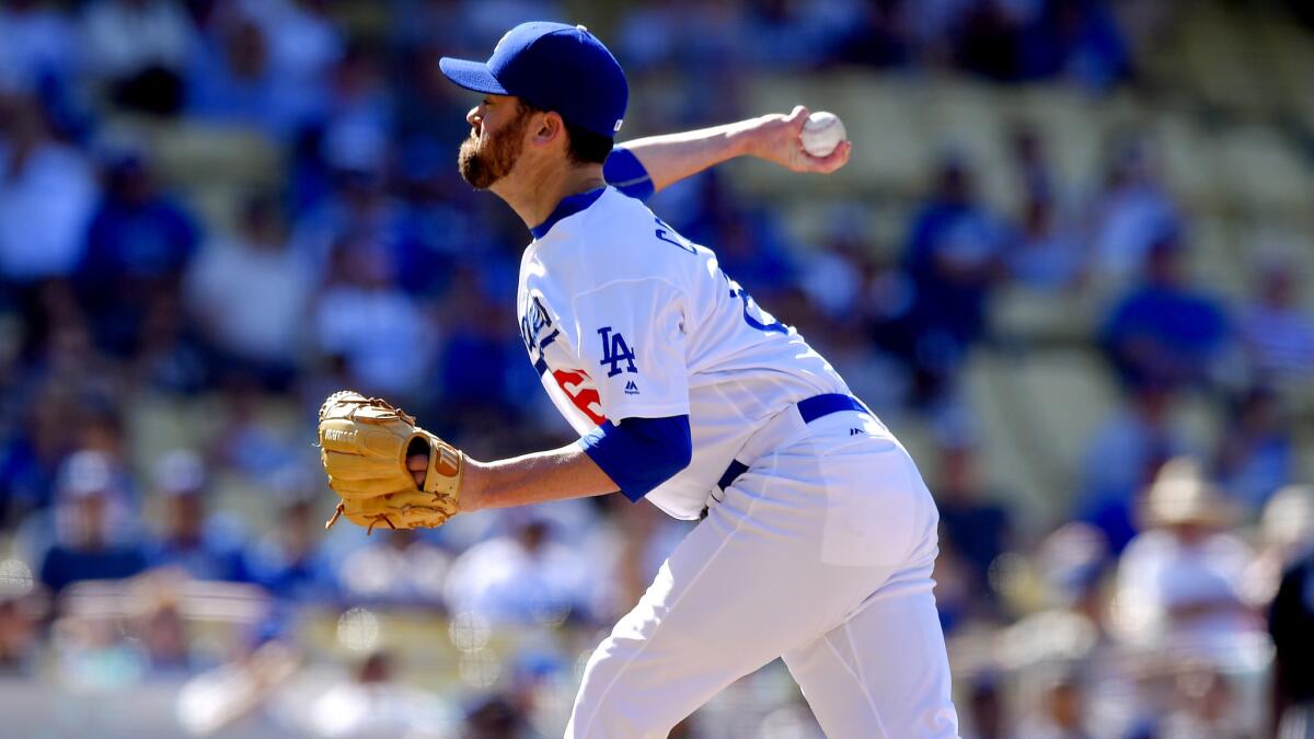 Dodgers reliever Louis Coleman delivers a pitch against the Braves last Sunday.