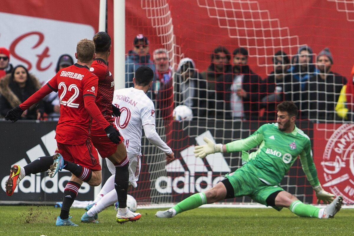 New York Red Bulls' Lewis Morgan scores and completes his hat trick against Toronto FC during the first half of an MLS soccer match, in Toronto, Saturday, March 5, 2022. (Chris Young/The Canadian Press via AP)