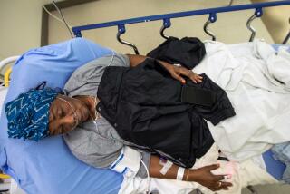 Los Angeles, CA - December 10: Ruby Harvey was brought into the emergency department at MLK Community Hospital on Saturday, Dec. 10, 2022, in Los Angeles, CA. She has covid pneumonia. (Francine Orr / Los Angeles Times)