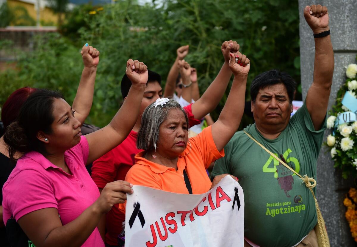 Relatives and friends of 43 missing students in Mexico demonstrate in Iguala, Guerrero state, on Sept. 27 to commemorate the first anniversary of their disappearance.