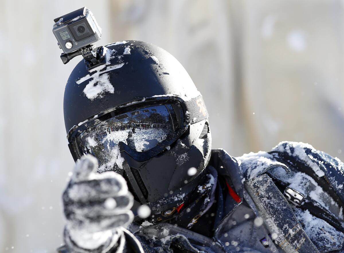 A man with a GoPro mounted on his helmet takes part in an organized snowball fight in Washington, D.C., last week. GoPro and Twitter have announced a partnership around live video.