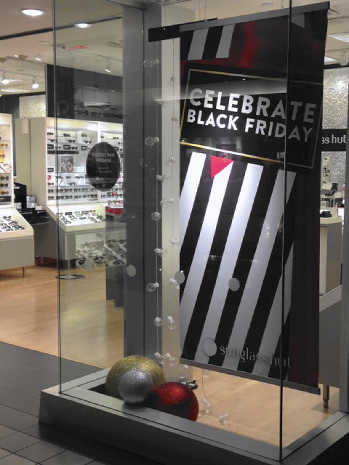 Signs for Black Friday deals are seen at the Fifth Avenue Mall in downtown Anchorage, one of only a few places in the state where rural Alaskans can go if they want to partake in the post-Thanksgiving consumer tradition.