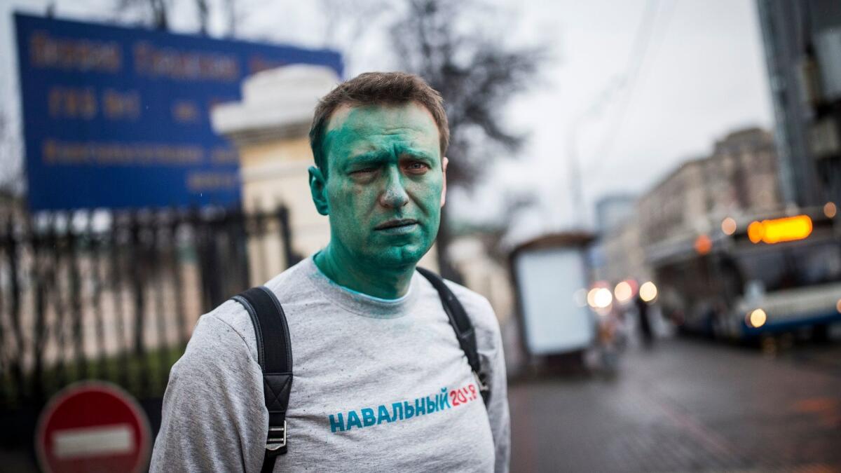 In this photo taken on April 27, 2017, Russian opposition leader Alexei Navalny poses after unknown attackers doused him with green antiseptic outside a conference venue in Moscow.