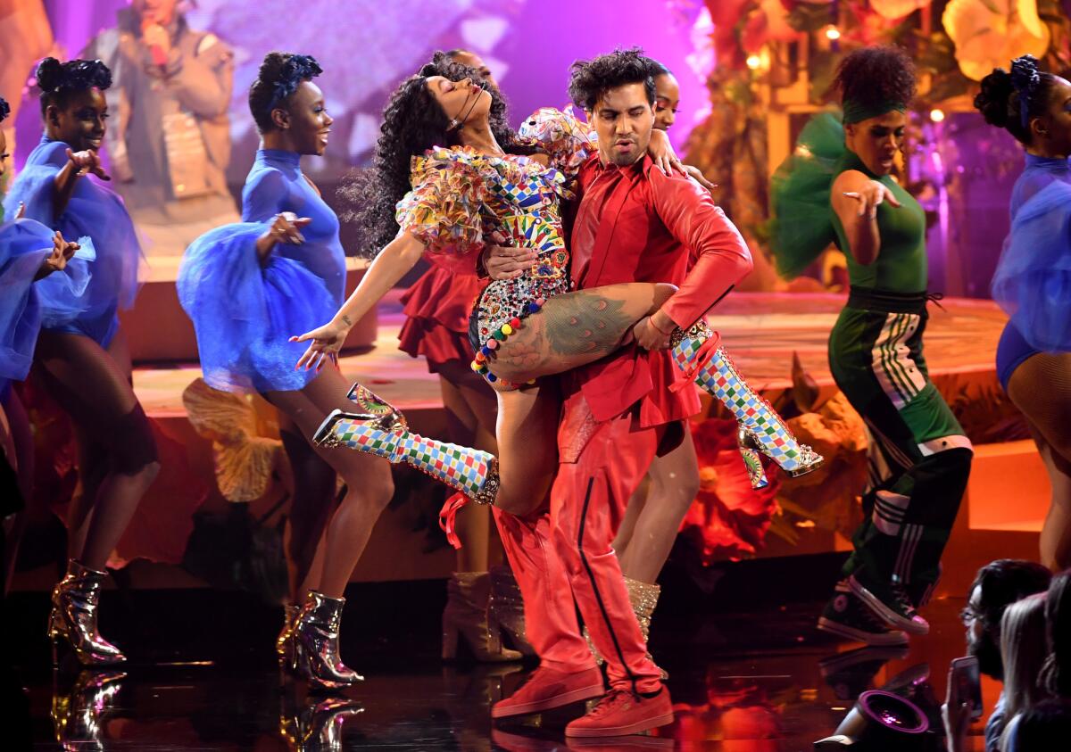 Cardi B stole the show with her colorful rendition of "I Like It" at Tuesday's American Music Awards.