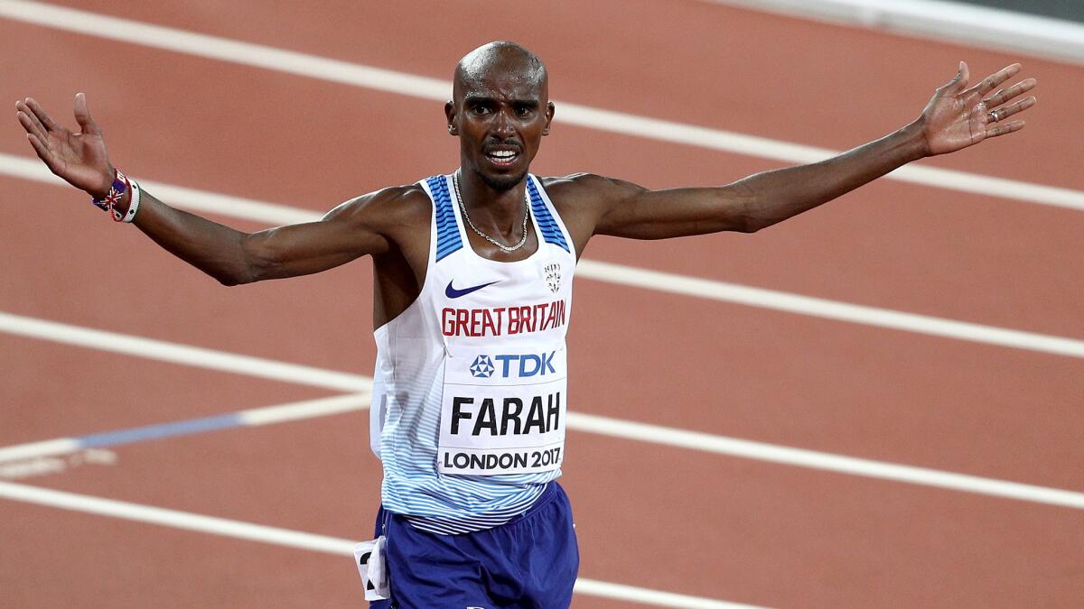 Mo Farah celebrates after winning gold in the 10,000 meters at the world championships on Friday.