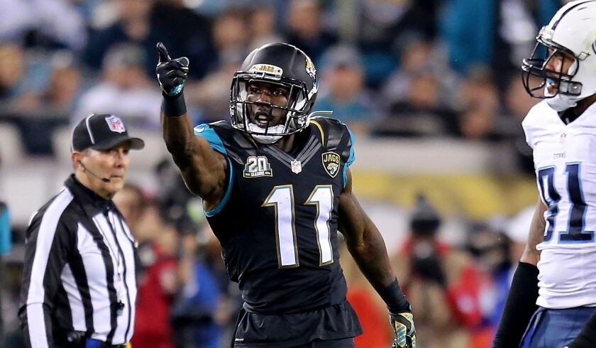 Jacksonville Jaguars receiver Marqise Lee signals for a first down after drawing a penalty against the Tennessee Titans during a Dec. 18, 2014, game in Jacksonville.