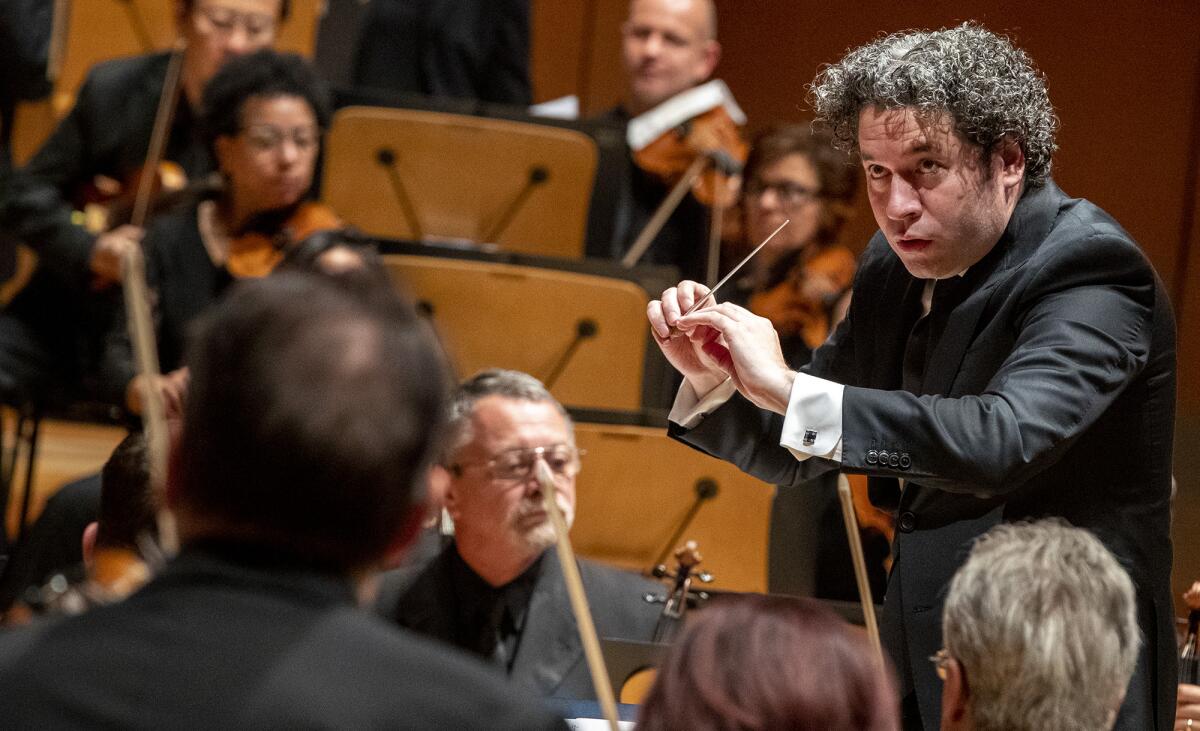Gustavo Dudamel conducts the L.A. Phil during performance of  Andrew Norman’s centennial commission, “Sustain,” at Walt Disney Concert Hall in Los Angeles on Nov. 2.