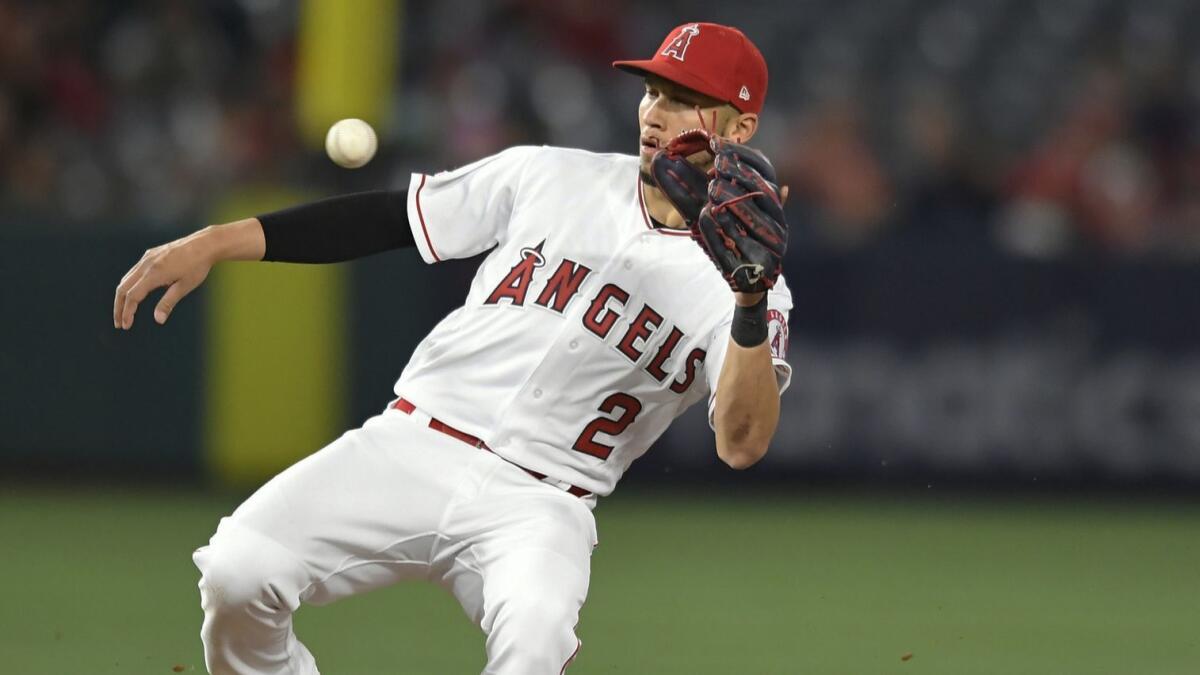 Angel's Andrelton Simmons catches the ball against the Seattle Mariners the sixth inning at Angel Stadium on April 18.
