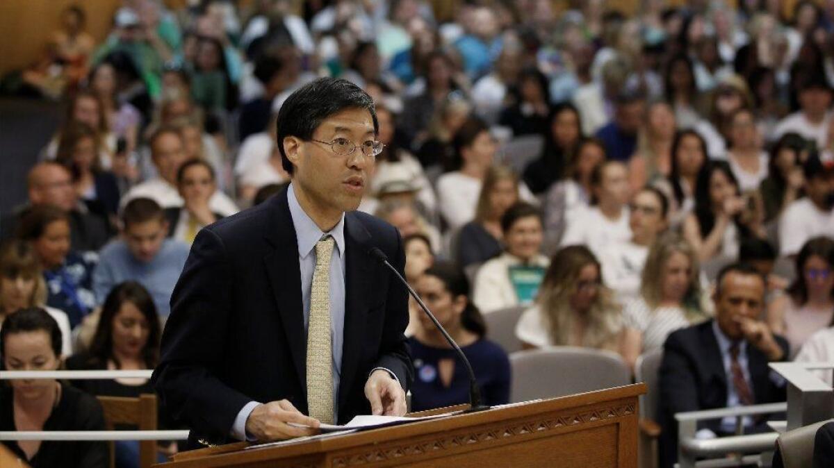 State Sen. Dr. Richard Pan (D-Sacramento) urges colleagues to support his proposal to give state health officials the power to decide which children can skip their shots before attending school.