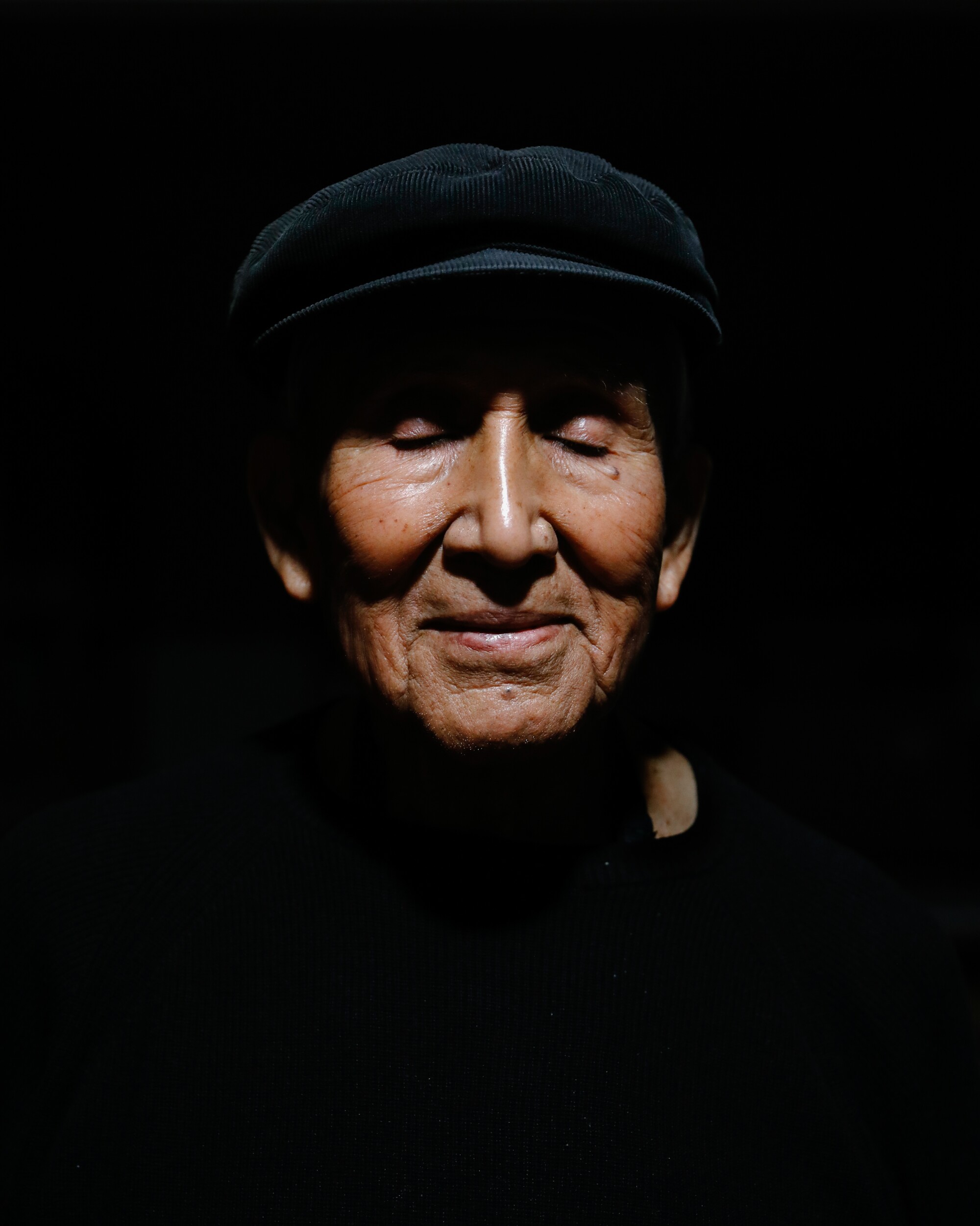 Ernest Siva, 84, closes his eyes for a portrait.