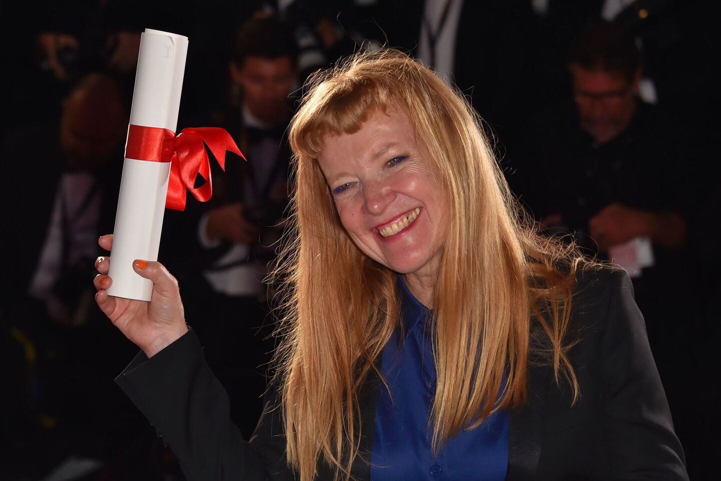 British director Andrea Arnold poses with her trophy during a photo call after she was awarded with the Jury Prize for the film "American Honey" at 69th Cannes Film Festival.