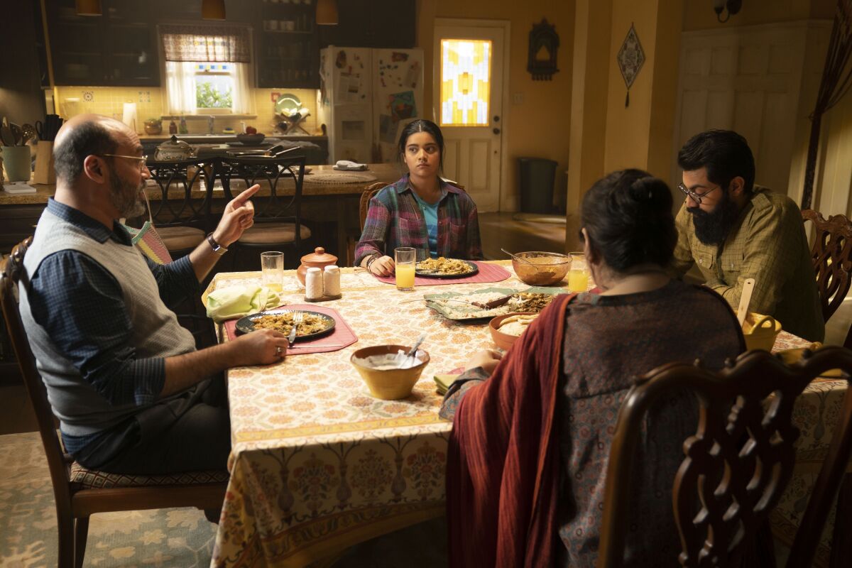 A family around the kitchen table eating