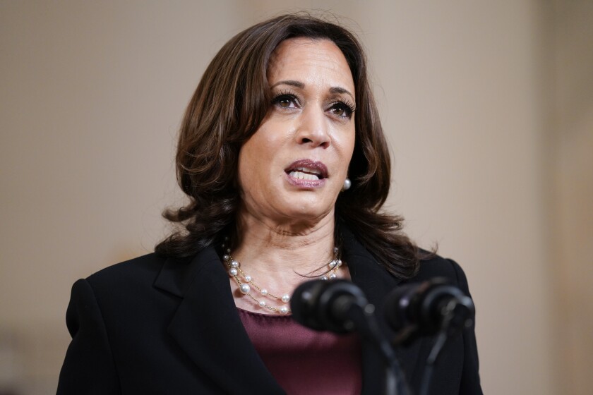 Kamala Harris speaking at a news conference 