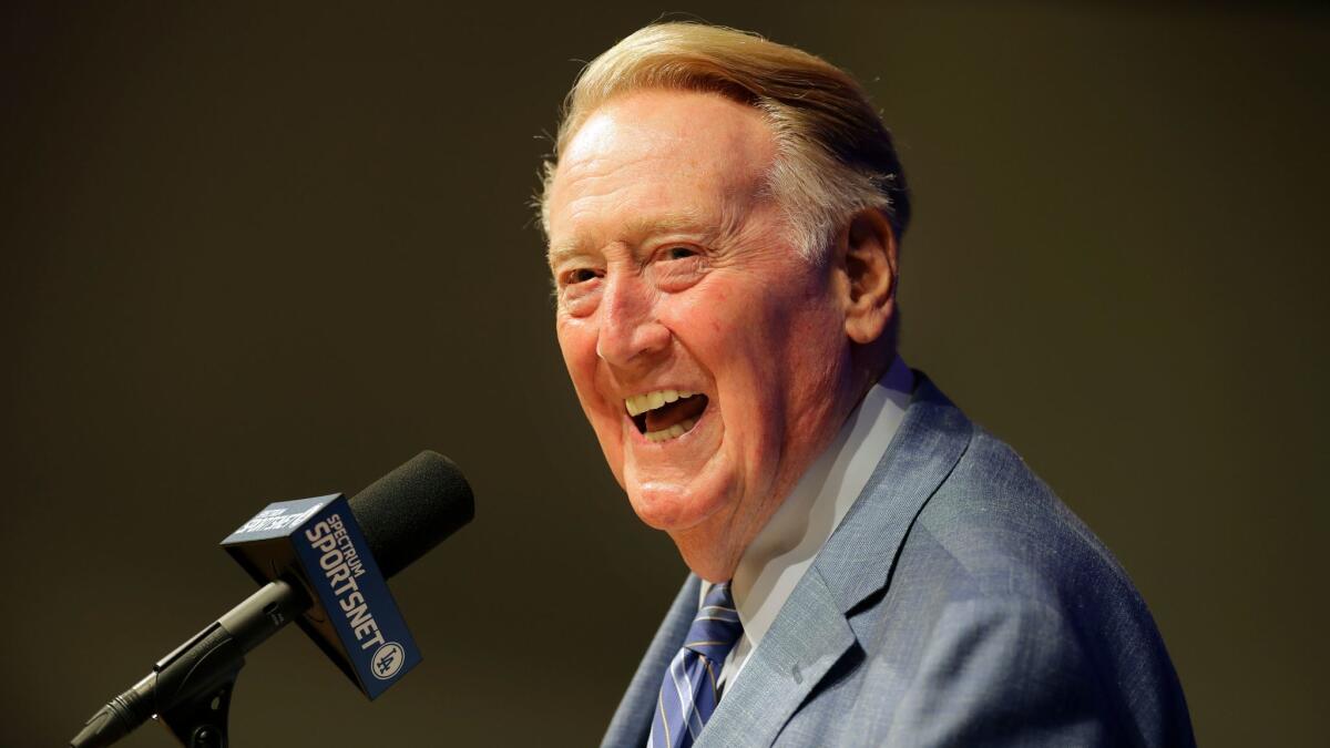 Hall of Fame broadcaster Vin Scully answers questions during a news conference at Dodger Stadium on Sept. 24.