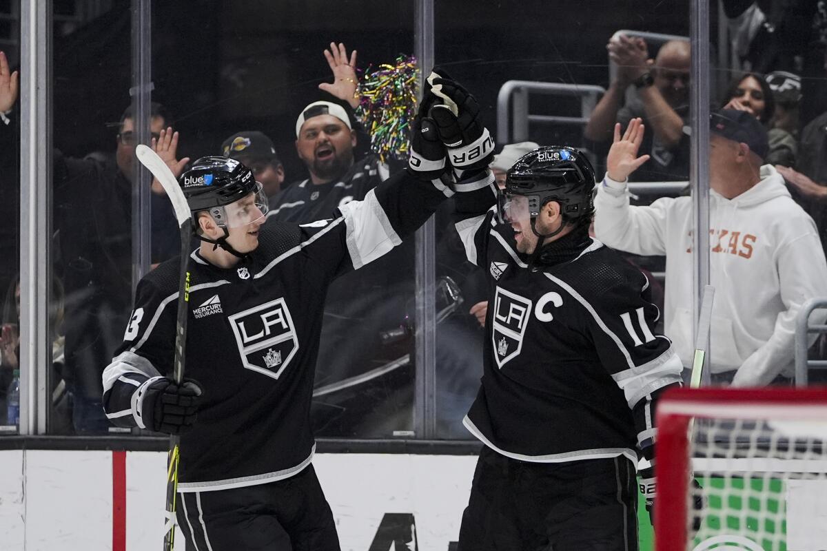 Anze Kopitar, right, celebrates a goal against Chicago with defenseman Jacob Moverare.