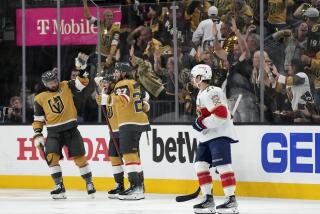 Vegas Golden Knights right wing Jonathan Marchessault, center, celebrates his goal against the Florida Panthers with defenseman Shea Theodore (27) during the third period of Game 2 of the NHL hockey Stanley Cup Finals, Monday, June 5, 2023, in Las Vegas. (AP Photo/John Locher)
