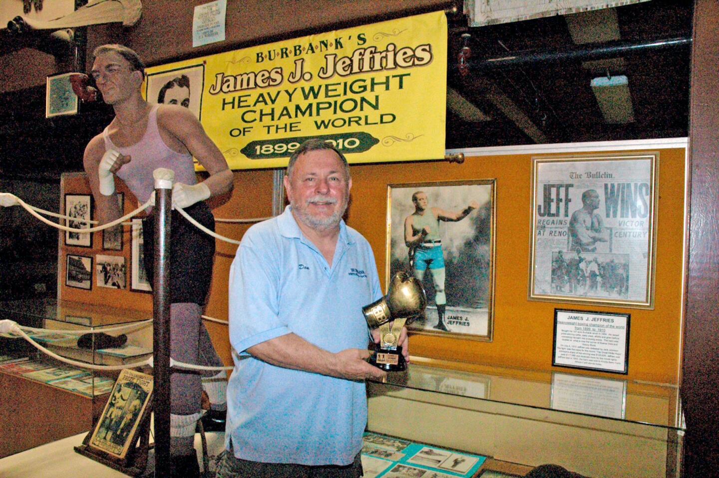 Don Baldaseroni holds the trophy given in honor of boxer James J. Jeffries from the National Boxing Hall of Fame.