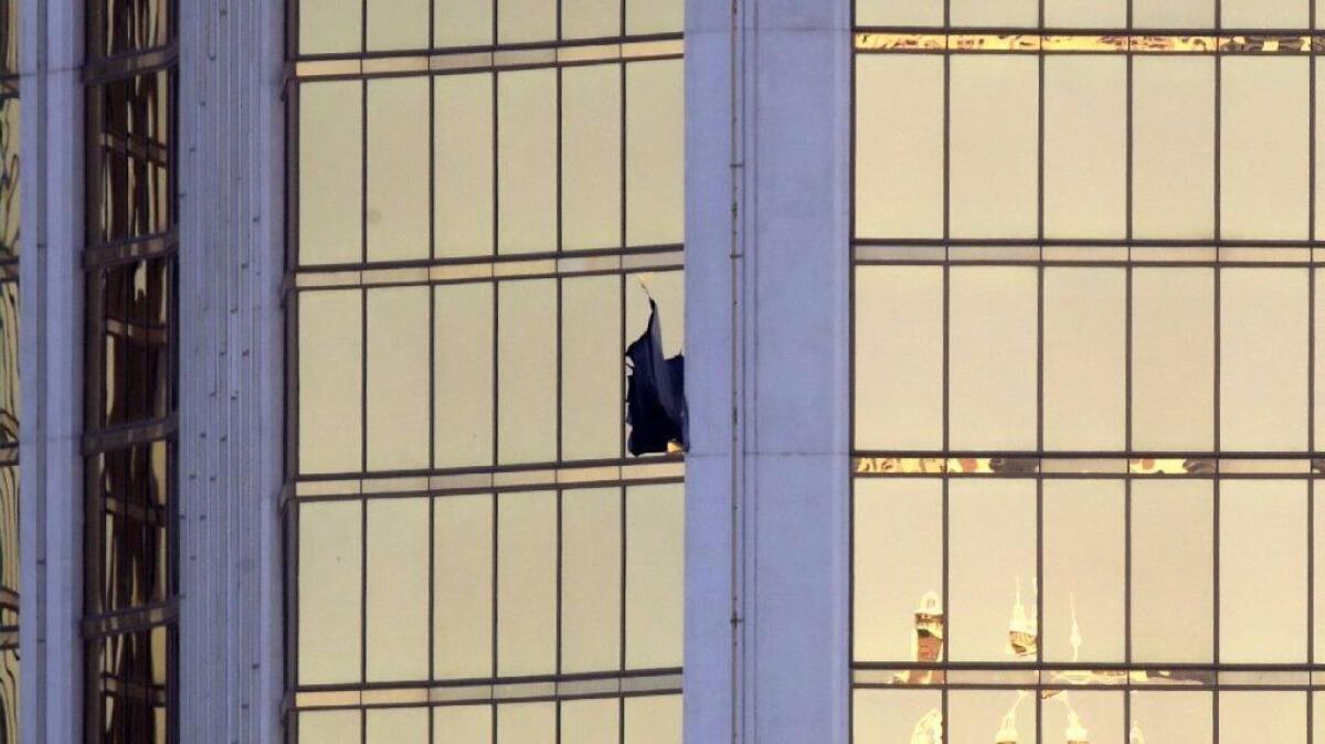 A broken window is seen at the Mandalay Bay Resort and Casino on Oct. 2 on the Las Vegas Strip.