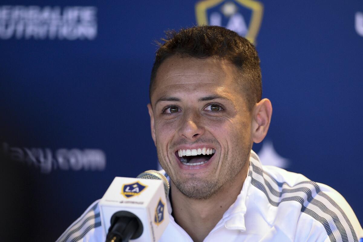 Los Angeles Galaxy's Javier "Chicharito" HernÃ(degrees)ndez speaks during a press conference in Carson, Calif., Thursday, Jan. 23, 2020. (AP Photo/Kelvin Kuo)