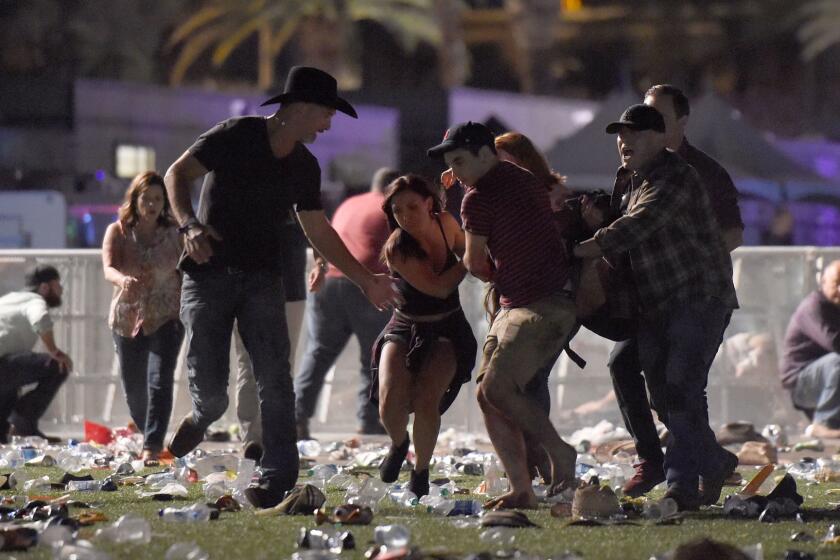 LAS VEGAS, NV - OCTOBER 01: (EDITORS NOTE: Image contains graphic content.) People carry a peson at the Route 91 Harvest country music festival after apparent gun fire was heard on October 1, 2017 in Las Vegas, Nevada. There are reports of an active shooter around the Mandalay Bay Resort and Casino. (Photo by David Becker/Getty Images) ** OUTS - ELSENT, FPG, CM - OUTS * NM, PH, VA if sourced by CT, LA or MoD **