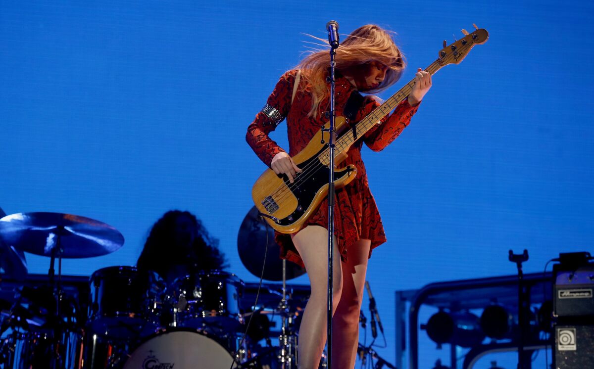 Bassist Este Haim performs with her sisters in the band called Haim.