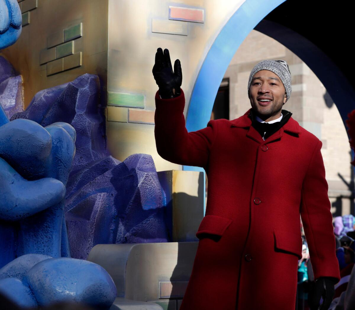 Singer John Legend waves from a float during the Macy's Thanksgiving Day Parade in New York.