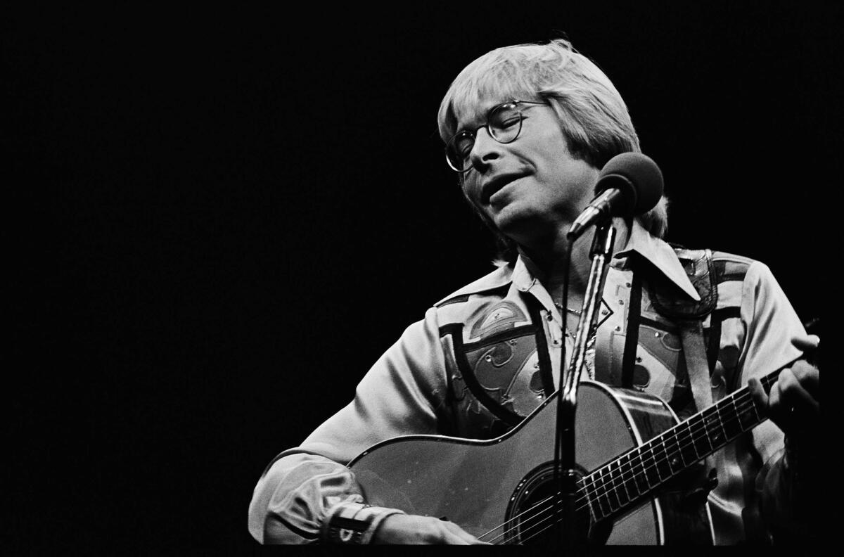 May 15, 1978: John Denver during a performance at the Forum in Inglewood.