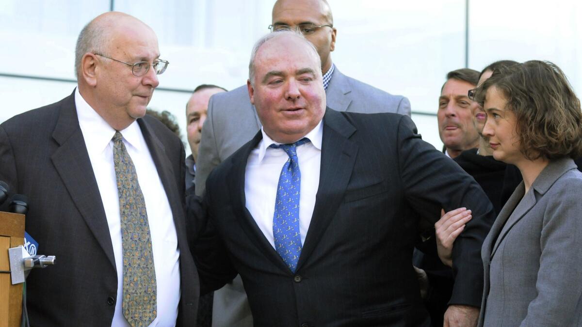Michael Skakel, center, with members of his legal team outside a Stamford, Conn., courthouse in 2013.