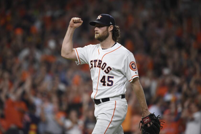 Houston Astros starting pitcher Gerrit Cole (45) reacts to an out against the Tampa Bay Rays during the seventh inning of Game 5 of a baseball American League Division Series in Houston, Thursday, Oct. 10, 2019. (AP Photo/Eric Christian Smith)