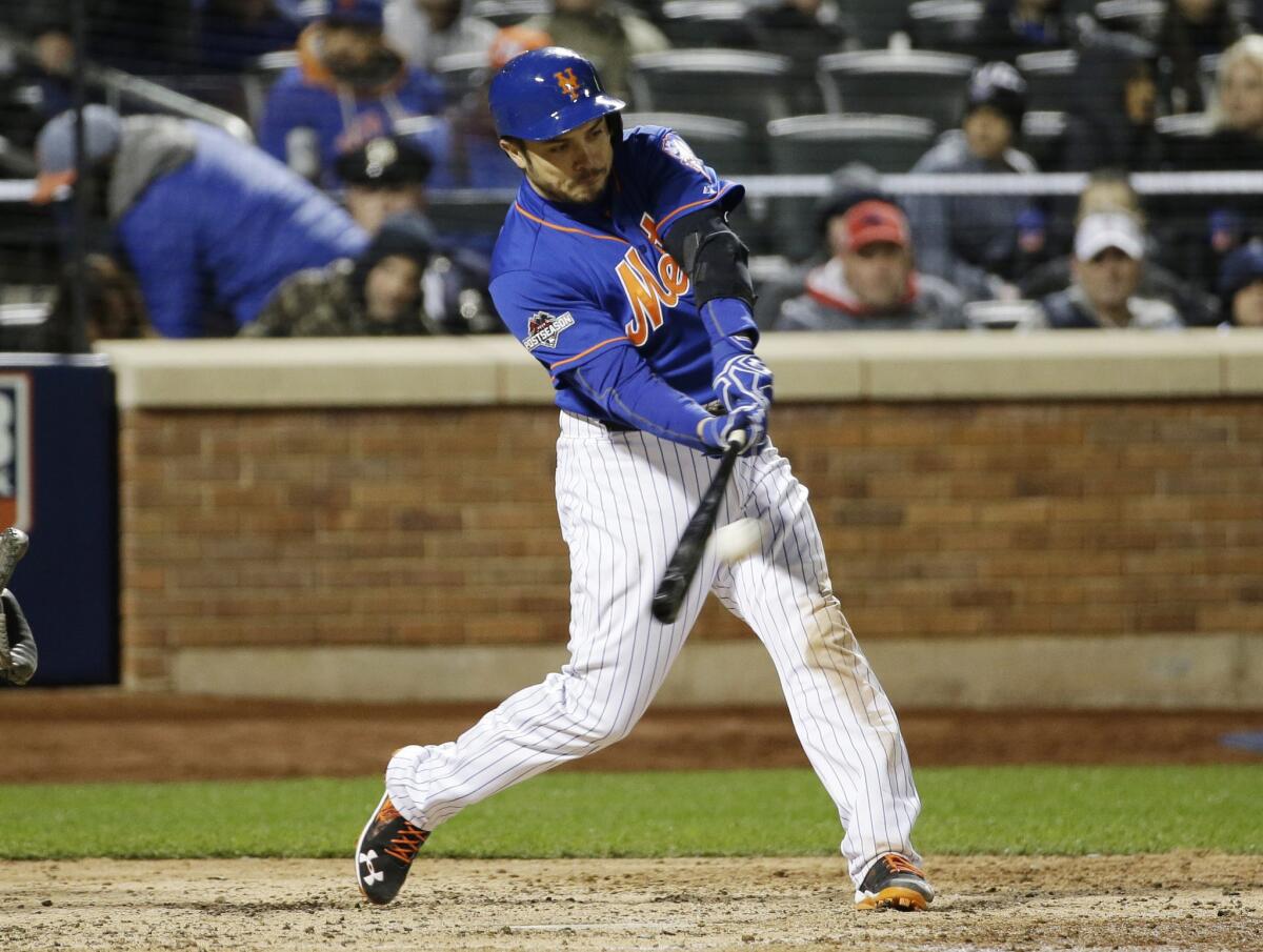 New York Mets catcher Travis d'Arnaud hits a home run during the sixth inning of Game 1 of the National League Championship Series against the Chicago Cubs on Oct. 17.