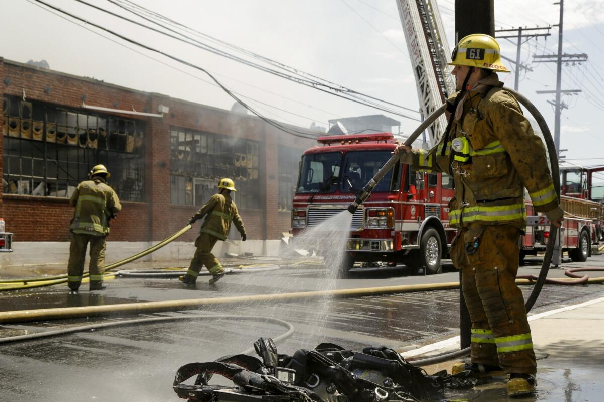 Heavy smoke and fire damaged a one-story commercial building at 1001 N. Orange Drive in Hollywood on July 13, 2014.