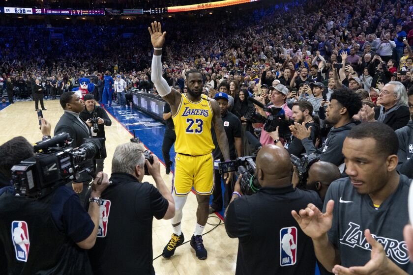 FILE - Los Angeles Lakers' LeBron James (23) reacts after moving to No. 3 on the NBA's career scoring list during the second half of the team's basketball game against the Philadelphia 76ers, Jan. 25, 2020, in Philadelphia. (AP Photo/Chris Szagola, File)