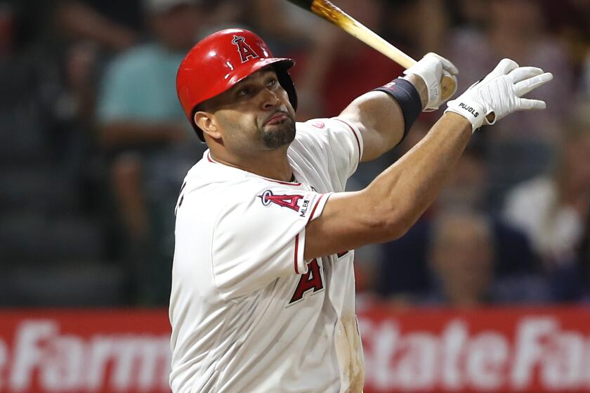 ANAHEIM, CALIFORNIA - AUGUST 31: Albert Pujols #5 of the Los Angeles Angels of Anaheim connects.