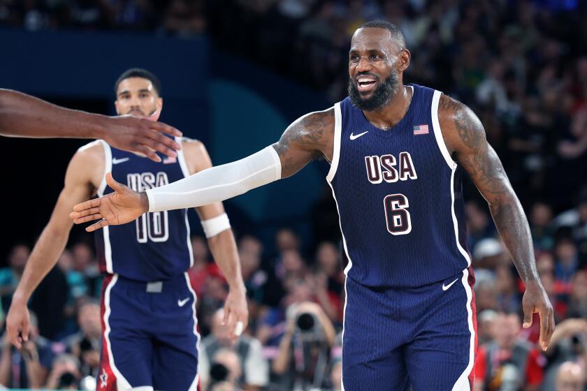 PARIS, FRANCE August 6, 2024-USA's LeBron James celebrates against Brazil in the quarterfinals at the 2024 Paris Olympics Tuesday. (Skalij/Los Angeles Times)