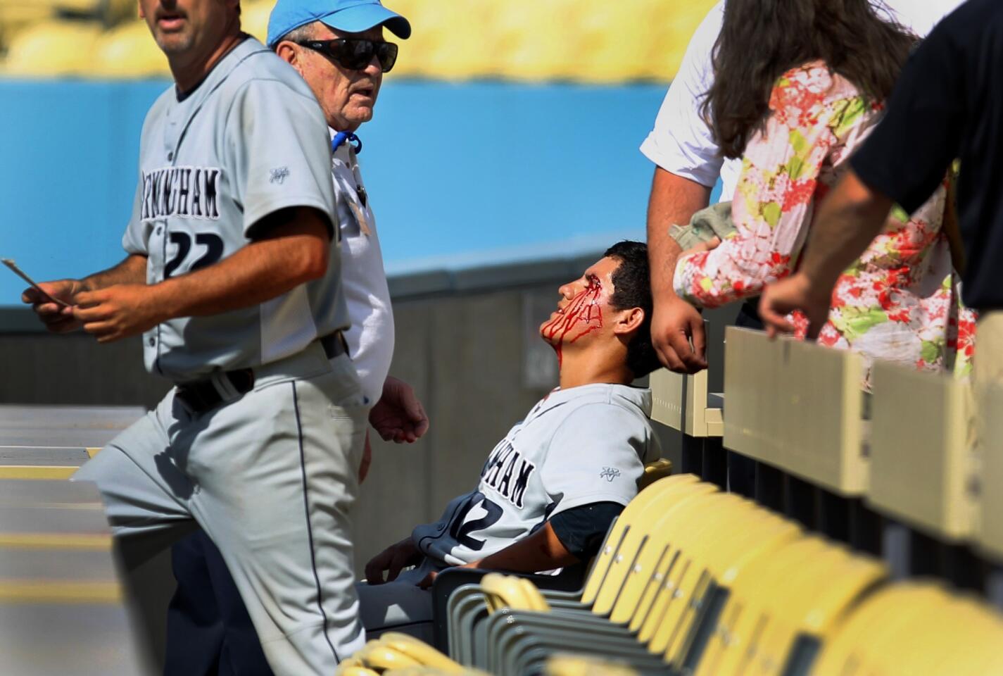 Birmingham first baseman Audelio Camacho missed the final out of Saturday's City Section Division I championship game after gashing his head while chasing a foul ball.