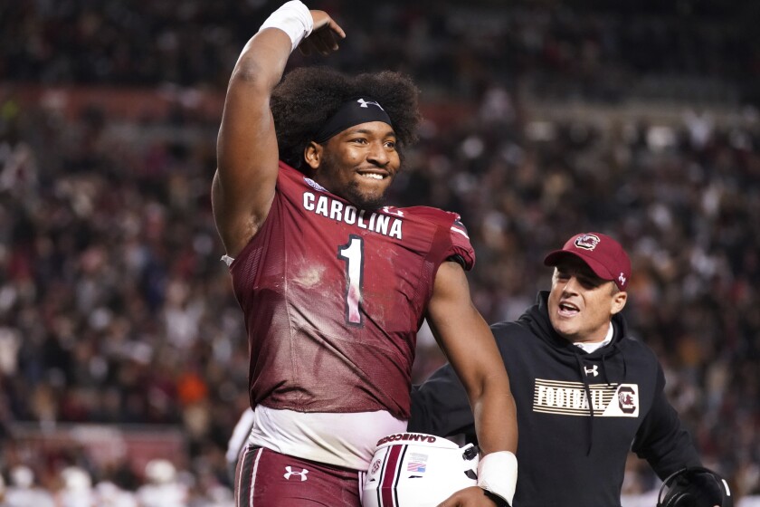 South Carolina defensive end Kingsley Enagbare (1) and head coach Shane Beamer react after an official's review ruled South Carolina's ball on a recovered punt during the second half of an NCAA college football game Saturday, Nov. 20, 2021, in Columbia, S.C. (AP Photo/Sean Rayford)