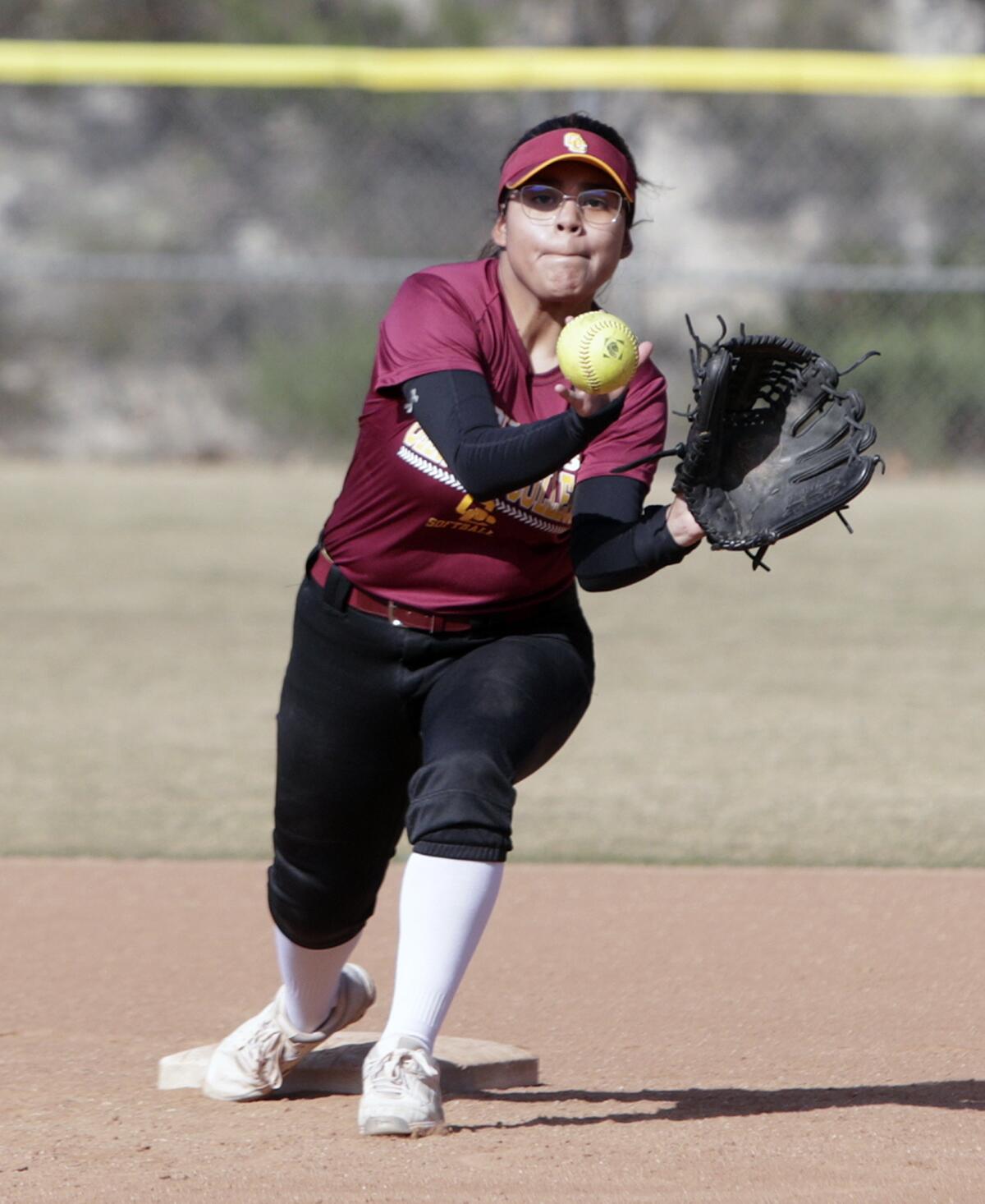 Glendale Community College’s Arleth Lima takes a throw at second base during a fielding drill at softball practice at the Glendale Sports Complex in Glendale on Monday, January 27, 2020.