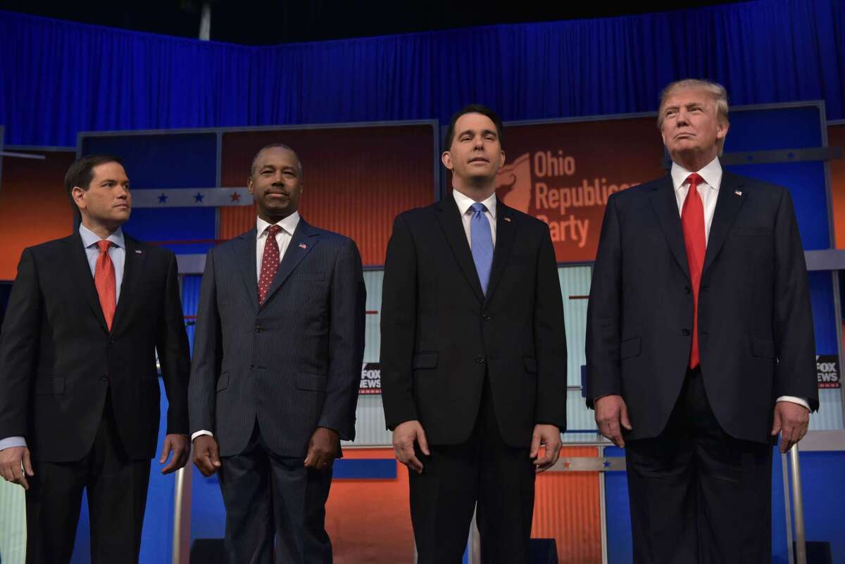 Marco Rubio, Ben Carson, Scott Walker and Donald Trump return to the stage following a break in the Republican presidential primary debate in Cleveland on Aug. 6.