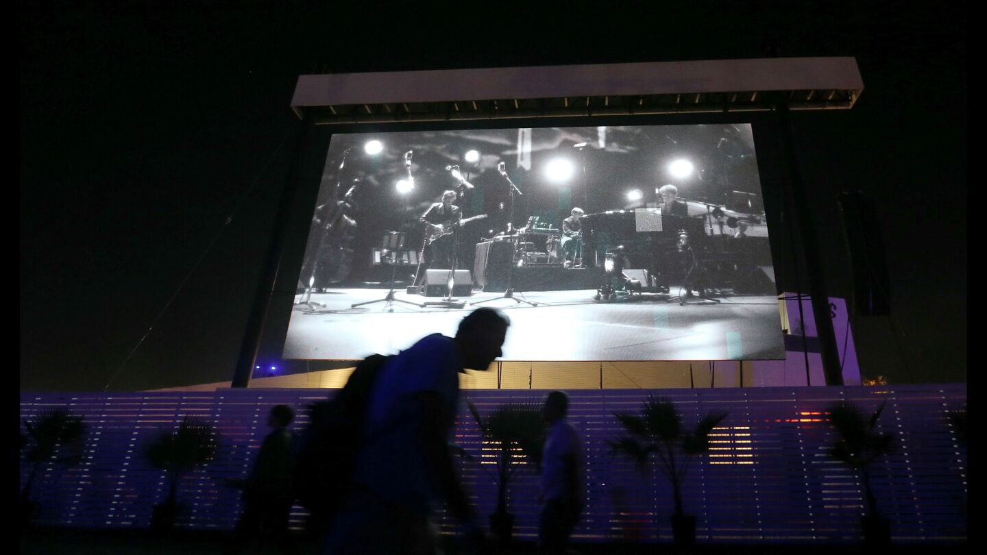 Bob Dylan is projected on a big screen as he opens Desert Trip's second weekend.
